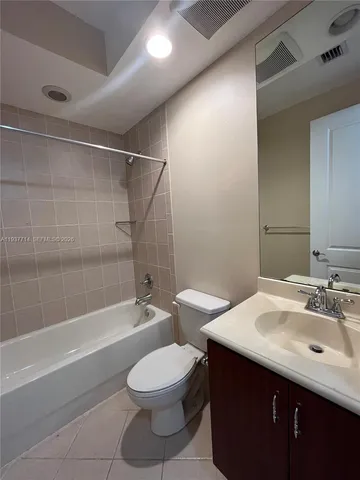 a bathroom with a sink a toilet and bathtub