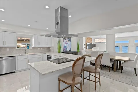 a kitchen with counter space dining table and chairs