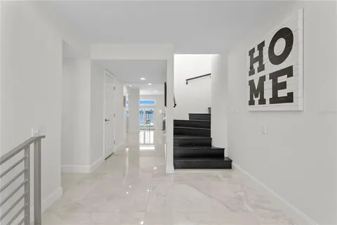 a bedroom with a bed dresser and a window