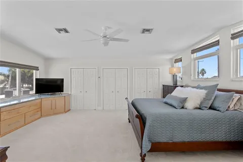 a bedroom with a large bed and furniture