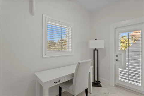 a bed room with a bed and a table