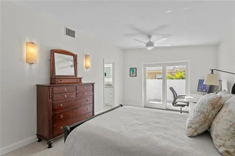 a bathroom with a granite countertop sink a mirror and a shower