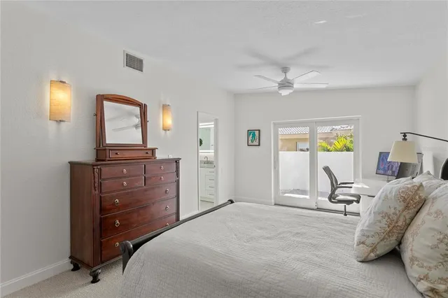 a bathroom with a granite countertop sink a mirror and a shower
