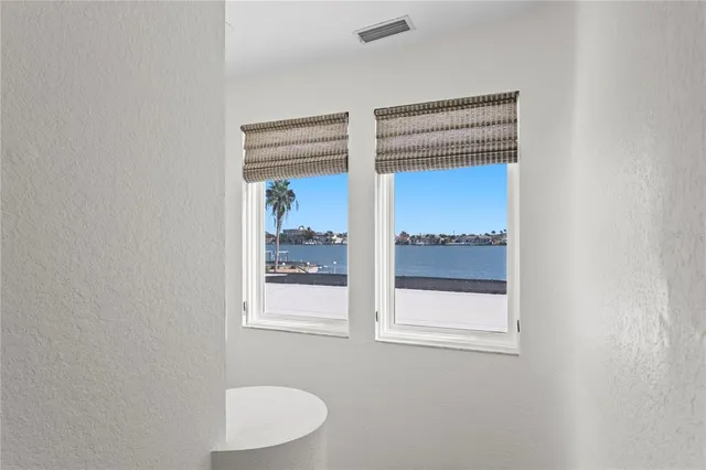a view of a house with swimming pool and sitting area