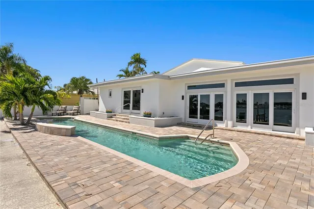 a view of a patio with swimming pool