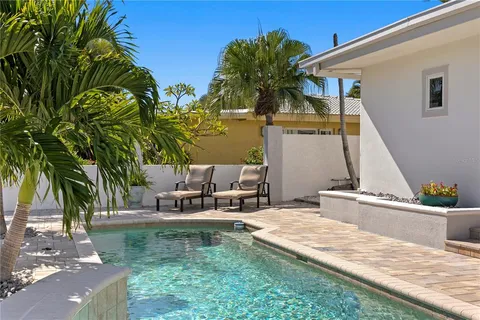 a view of a lake with couches and city view