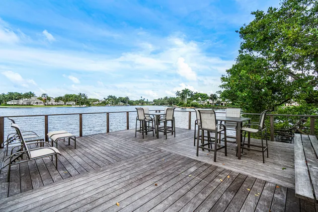 a view of roof deck with seating space and hardwood floor