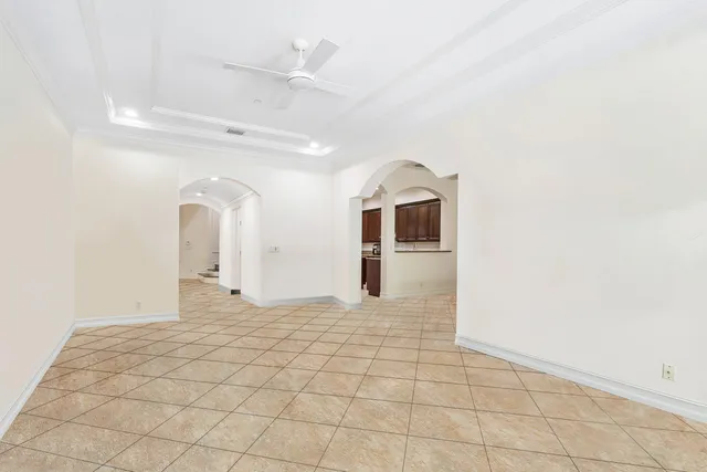 a kitchen with stainless steel appliances granite countertop wooden cabinets a sink dishwasher a stove and a refrigerator