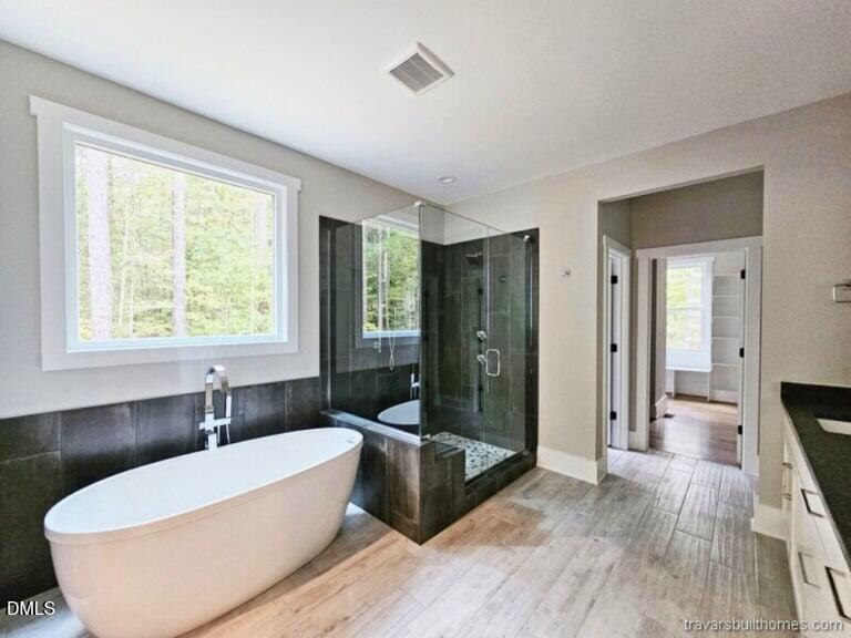 5491 Silk Hope Gum Spring Road Siler City, NC 27344 - Photo 11 of 17 a bathroom with a bathtub and a shower