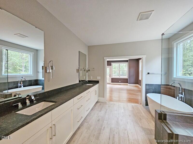 5491 Silk Hope Gum Spring Road Siler City, NC 27344 - Photo 13 of 17 a large bathroom with a large tub sink and window