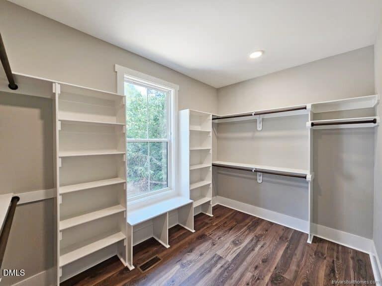5491 Silk Hope Gum Spring Road Siler City, NC 27344 - Photo 15 of 17 a room with wooden floor and a window