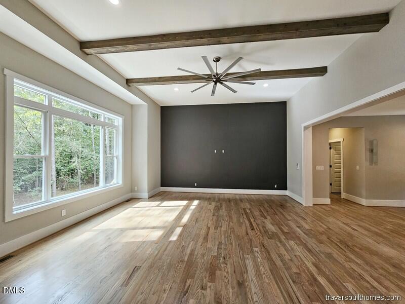 5491 Silk Hope Gum Spring Road Siler City, NC 27344 - Photo 4 of 17 a view of an empty room with glass door and windows