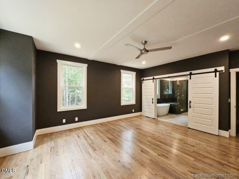 5491 Silk Hope Gum Spring Road Siler City, NC 27344 - Photo 8 of 17 a view of an empty room with a window and a kitchen
