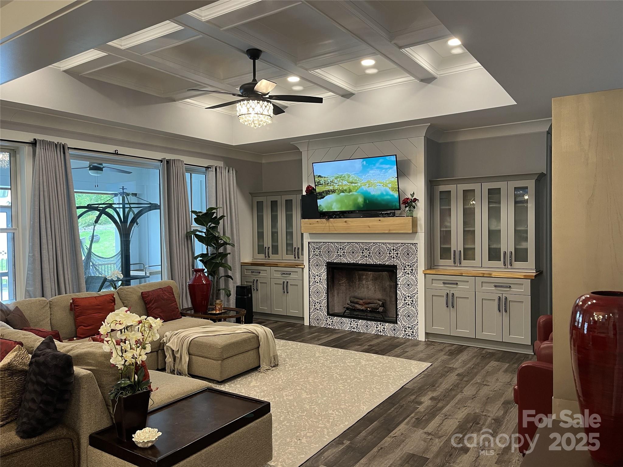 900 Houston Heights Road Charlotte, NC 28262 - Photo 11 of 44 a living room with furniture a flat screen tv and a fireplace