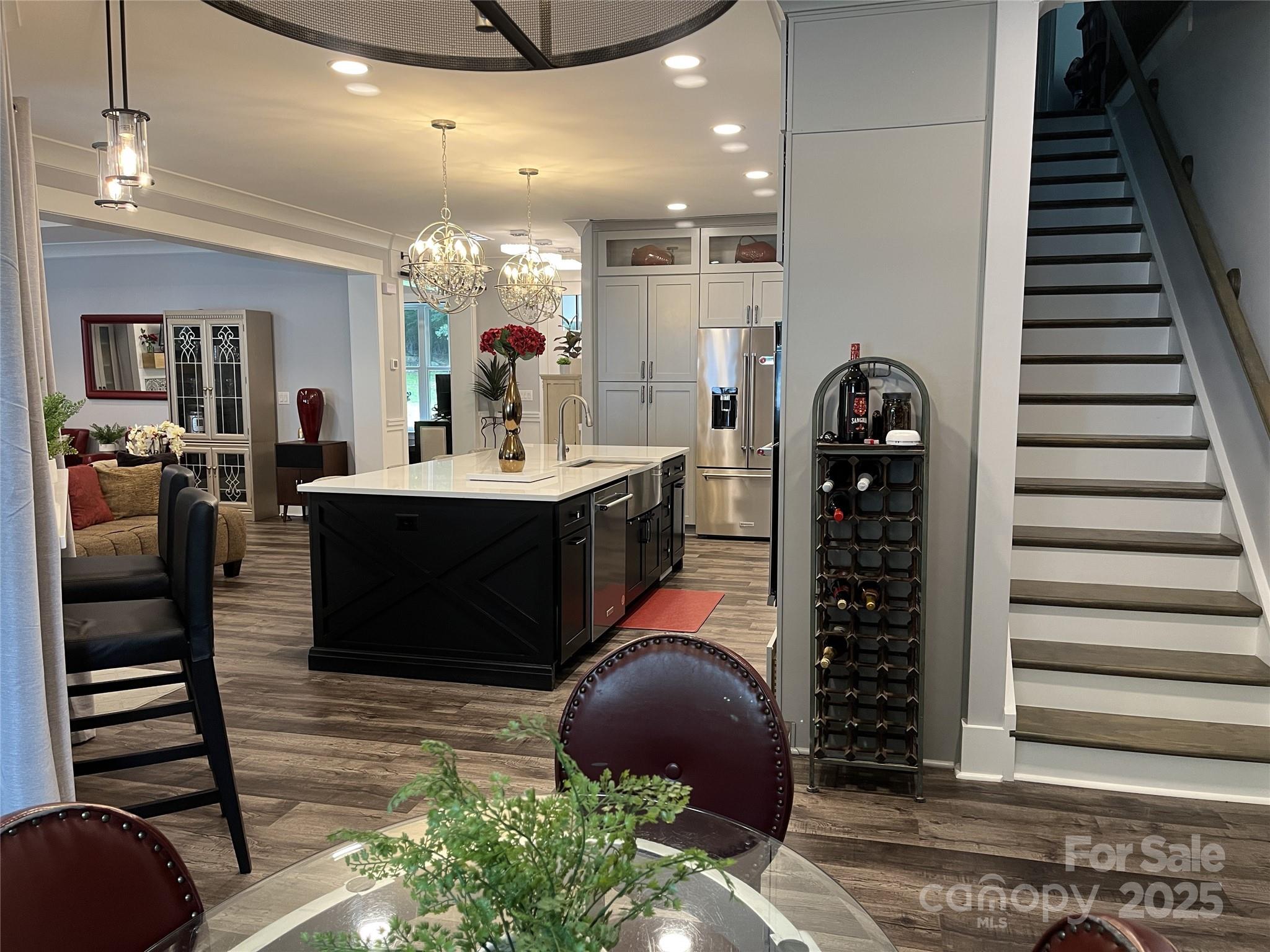 900 Houston Heights Road Charlotte, NC 28262 - Photo 14 of 44 a kitchen with stainless steel appliances kitchen island granite countertop a stove and cabinets