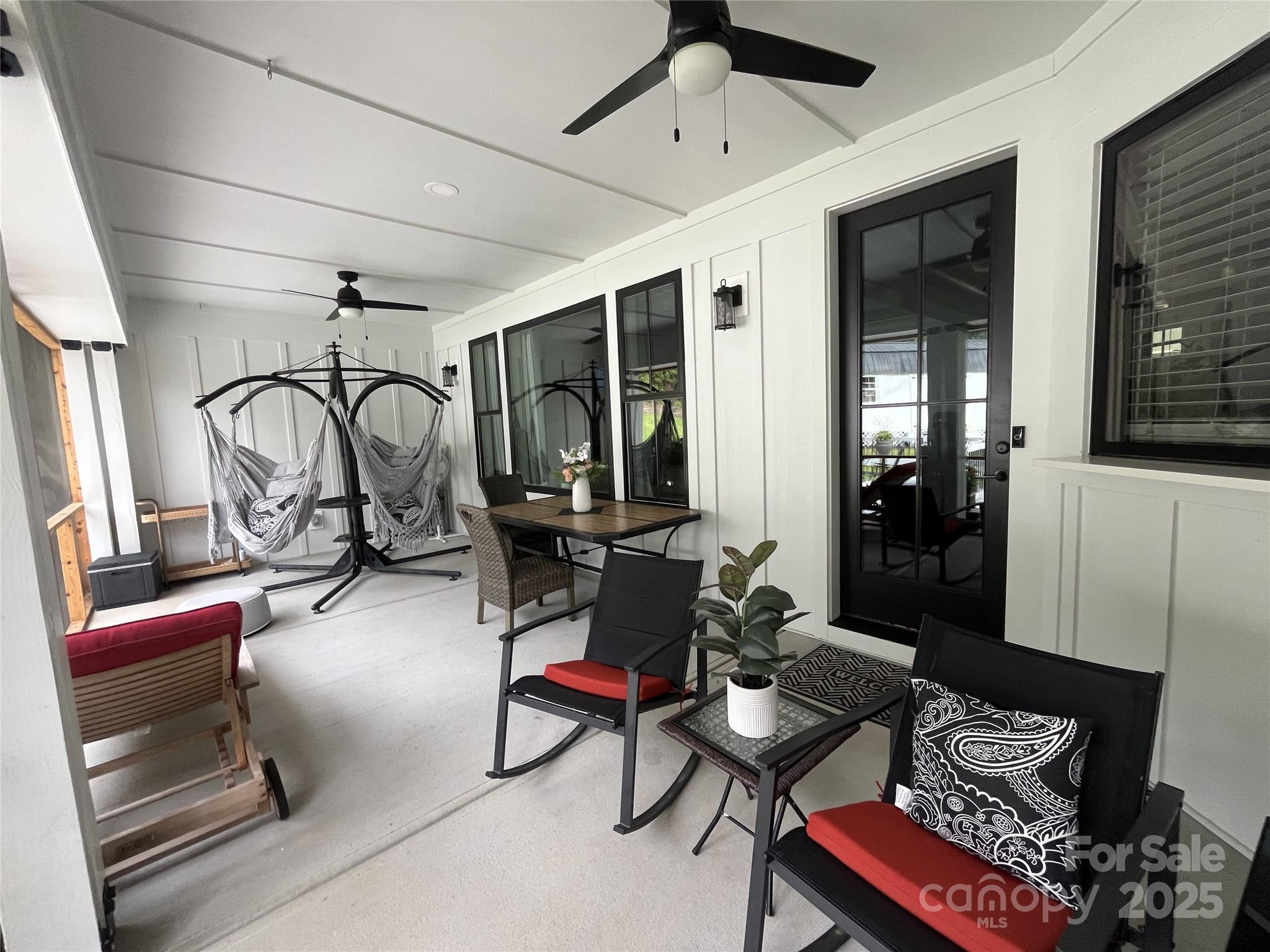900 Houston Heights Road Charlotte, NC 28262 - Photo 16 of 44 a living room with patio furniture and a flat screen tv