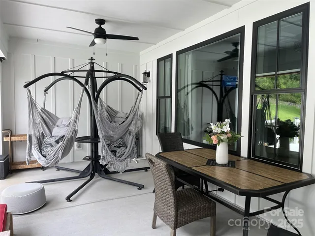 a view of a dining room with furniture window and outside view