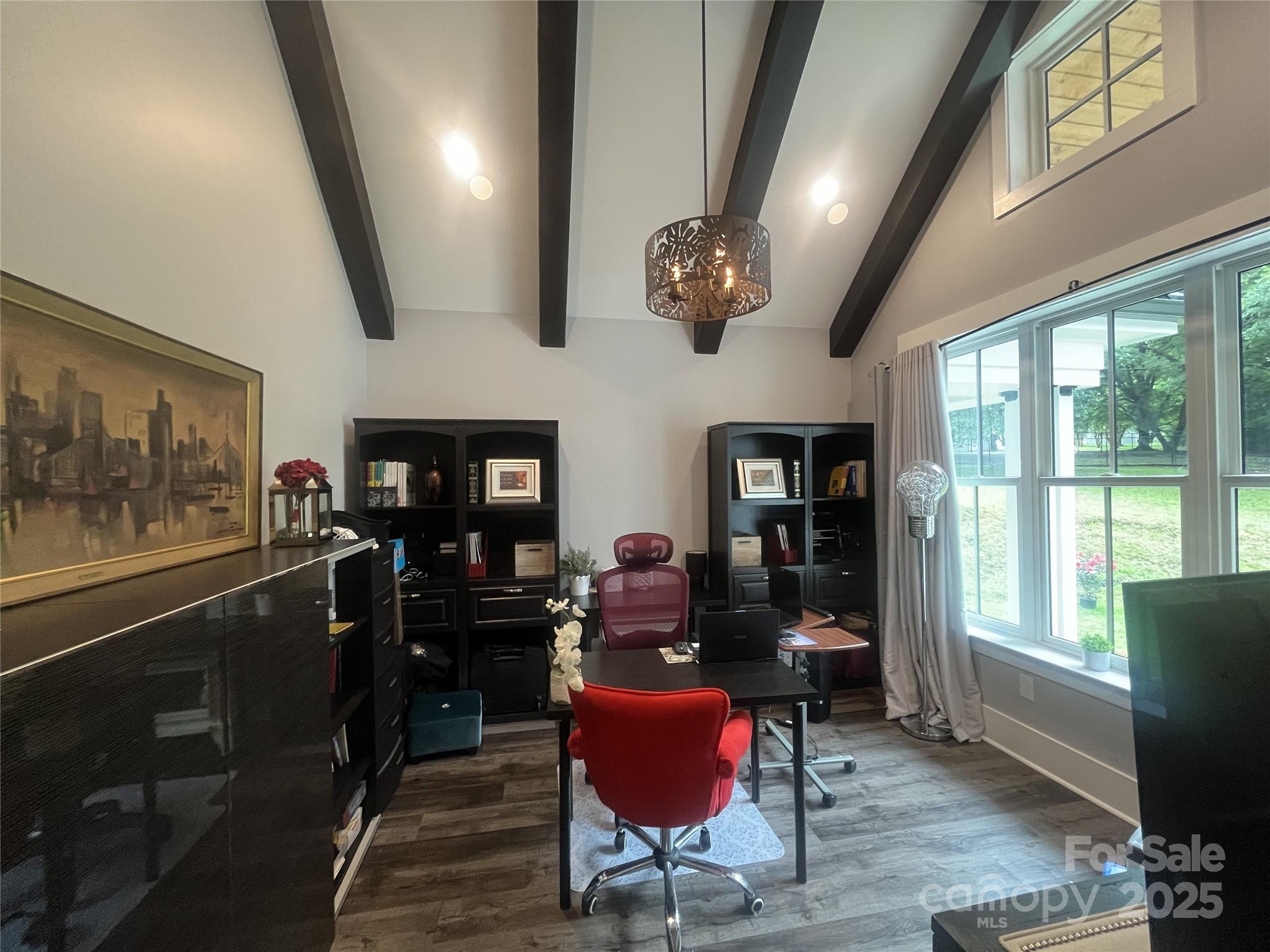 900 Houston Heights Road Charlotte, NC 28262 - Photo 21 of 44 a dining room with furniture a flat screen tv and floor to ceiling window