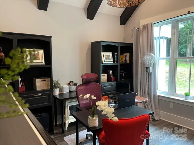 a living room with furniture fireplace and flat screen tv