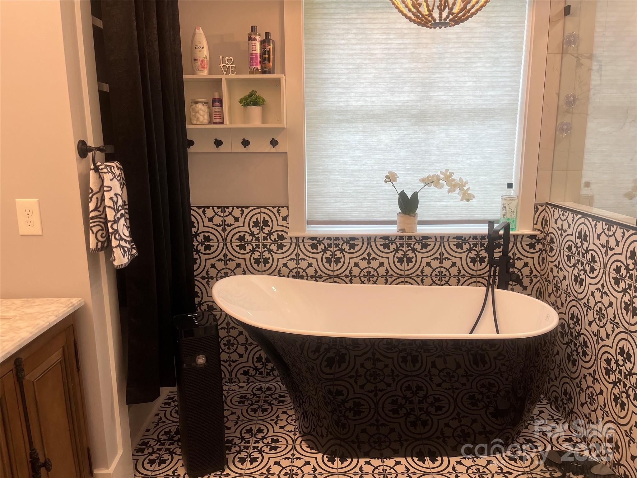 900 Houston Heights Road Charlotte, NC 28262 - Photo 27 of 44 a view of a bathtub in a bathroom