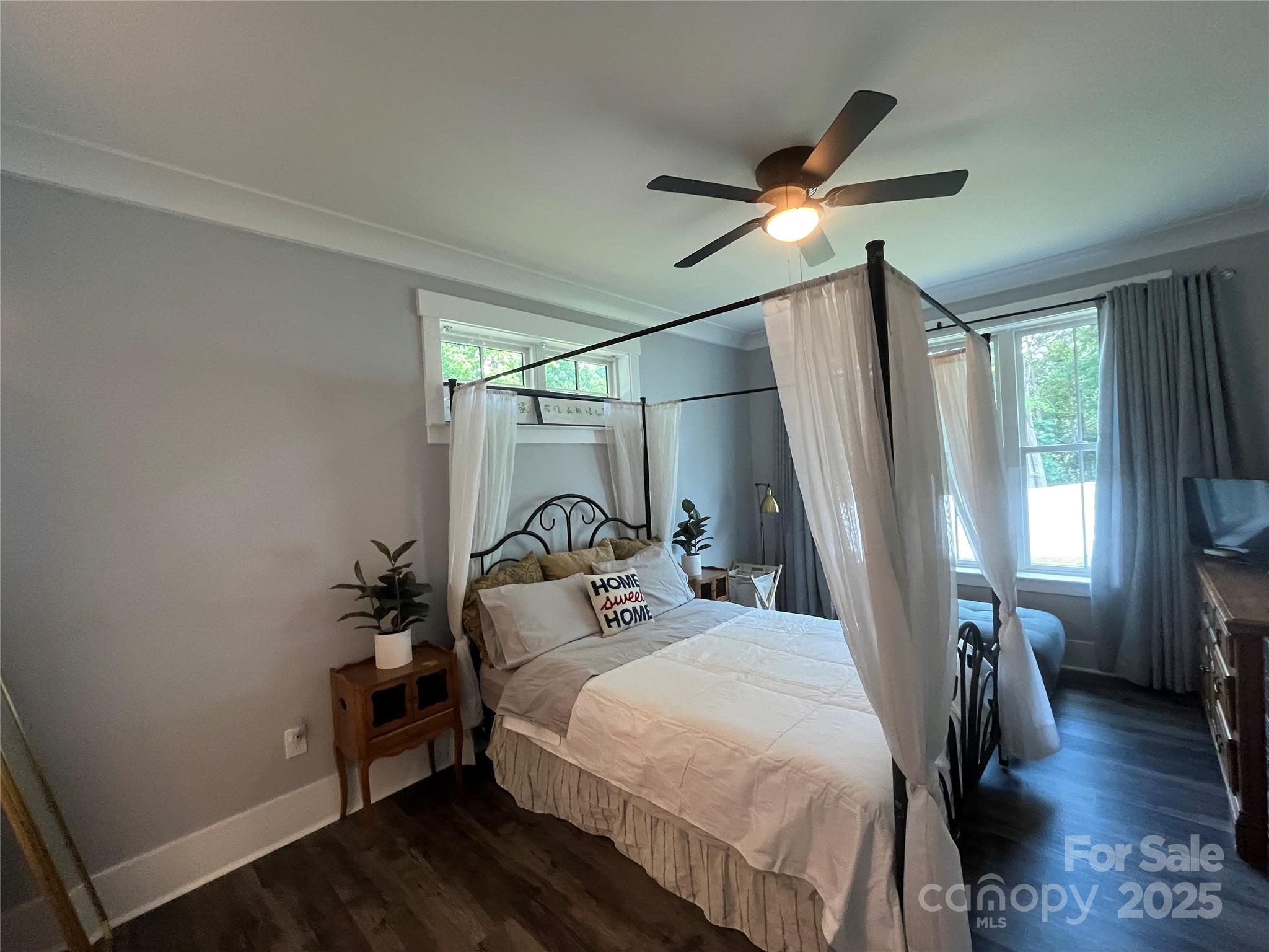 900 Houston Heights Road Charlotte, NC 28262 - Photo 30 of 44 a bedroom with a bed and a chandelier