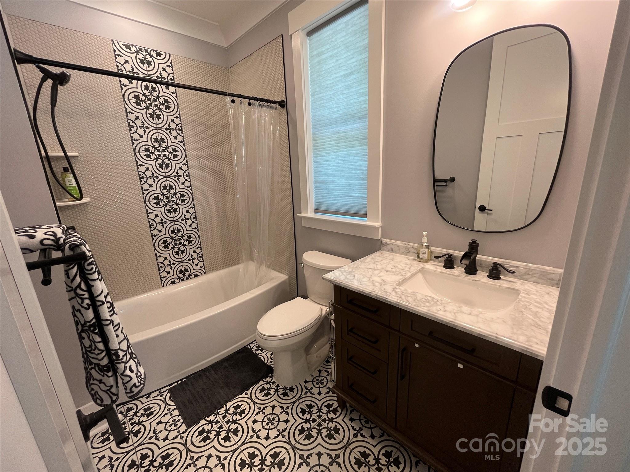 900 Houston Heights Road Charlotte, NC 28262 - Photo 31 of 44 a bathroom with a granite countertop sink toilet and a mirror