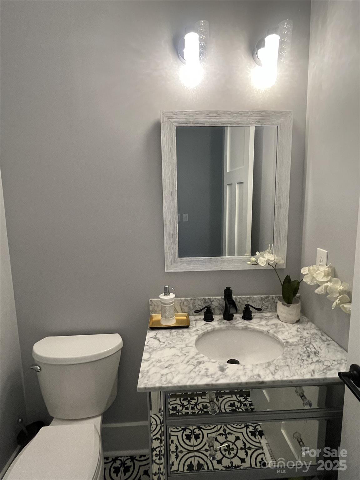 900 Houston Heights Road Charlotte, NC 28262 - Photo 38 of 44 a bathroom with a granite countertop sink and a toilet