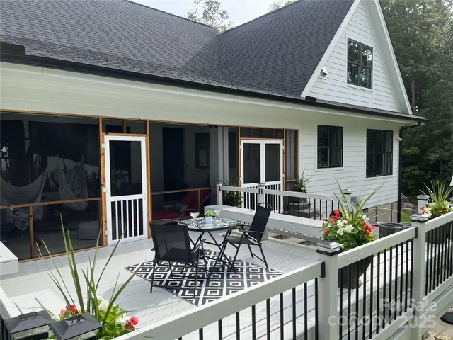 a view of a patio with a dining table and chairs