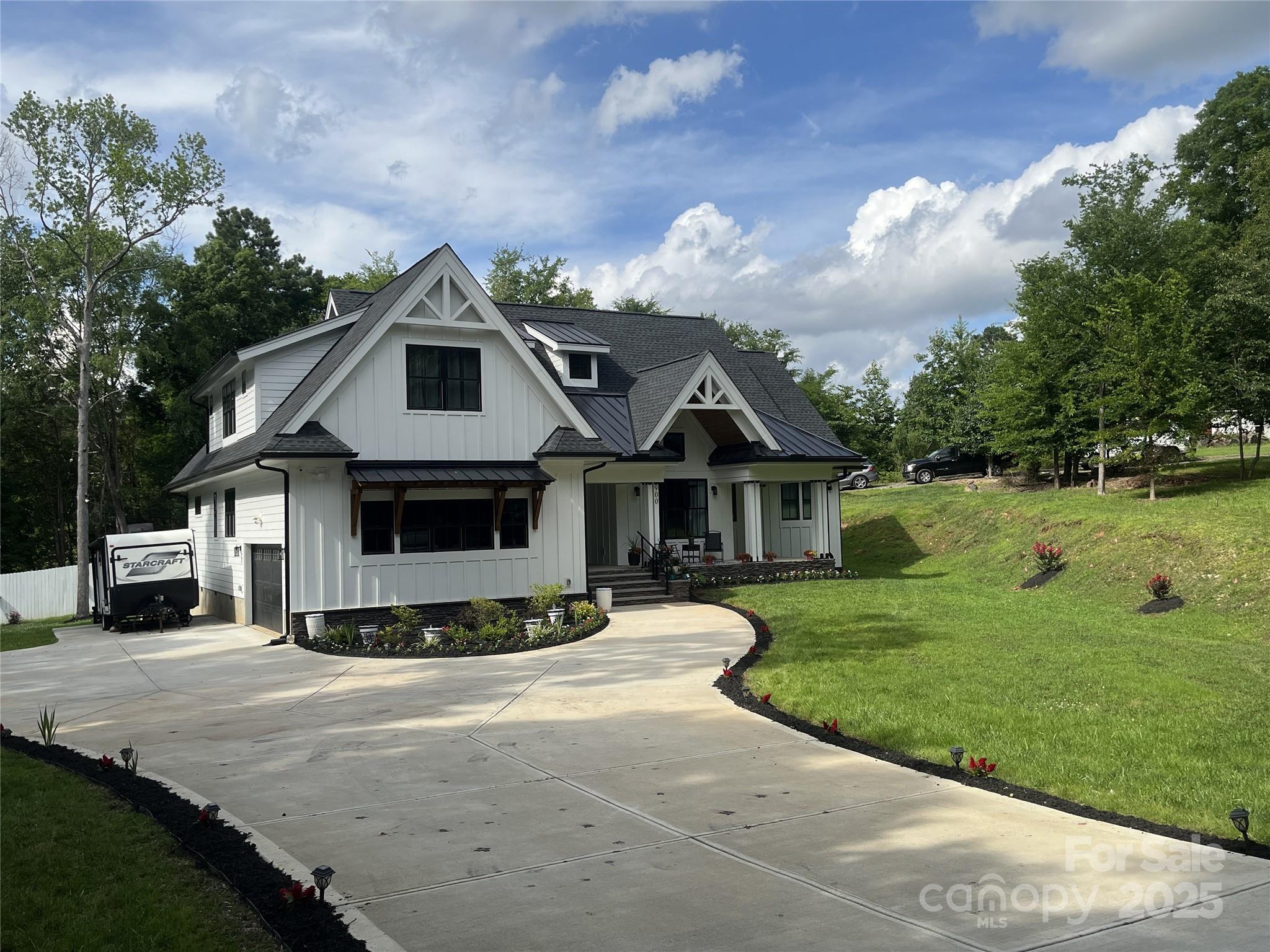 900 Houston Heights Road Charlotte, NC 28262 - Photo 4 of 44 a front view of a house with a yard