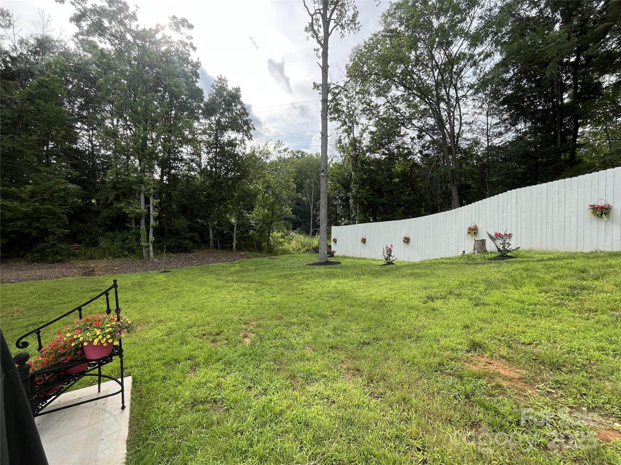 900 Houston Heights Road Charlotte, NC 28262 - Photo 42 of 44 a view of a garden with large trees