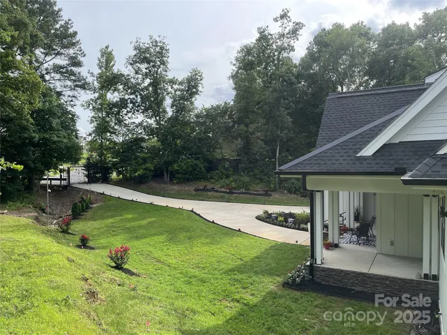 a view of a house with pool porch and sitting area