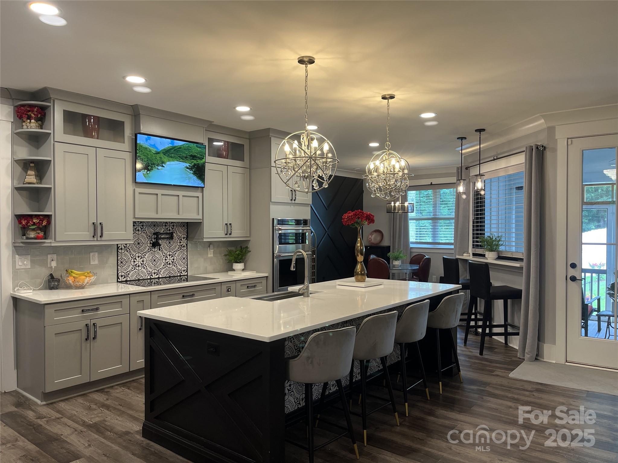 900 Houston Heights Road Charlotte, NC 28262 - Photo 5 of 44 a kitchen with a dining table chairs sink and cabinets