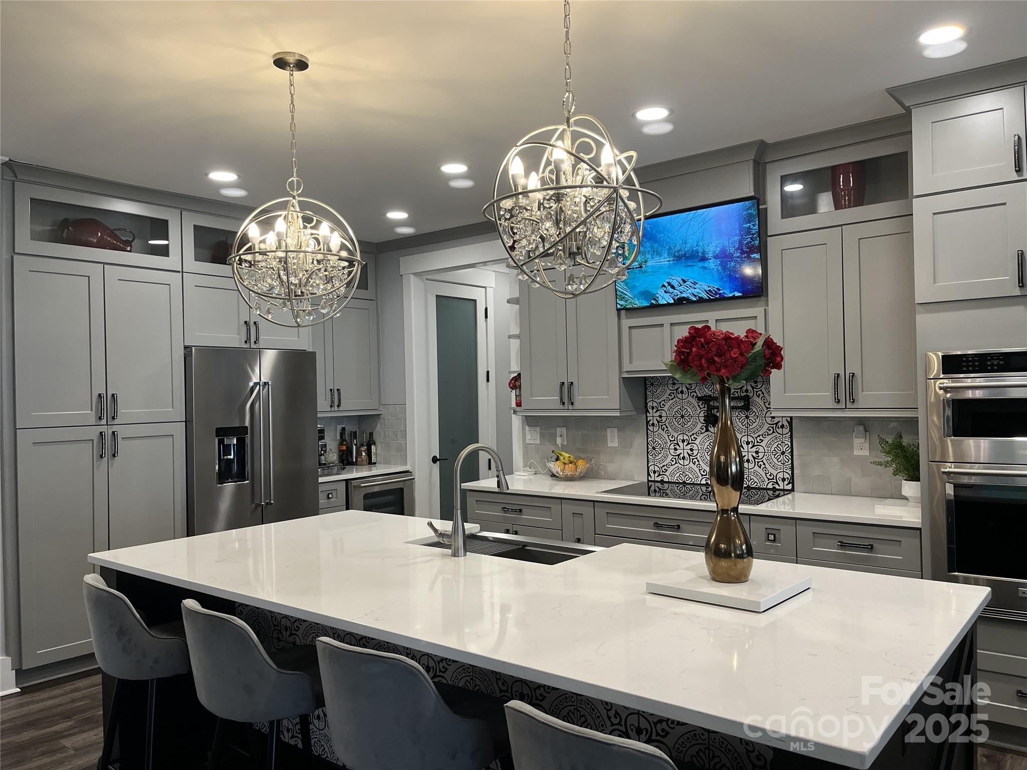 900 Houston Heights Road Charlotte, NC 28262 - Photo 8 of 44 a view of a dining room with furniture a chandelier and kitchen view