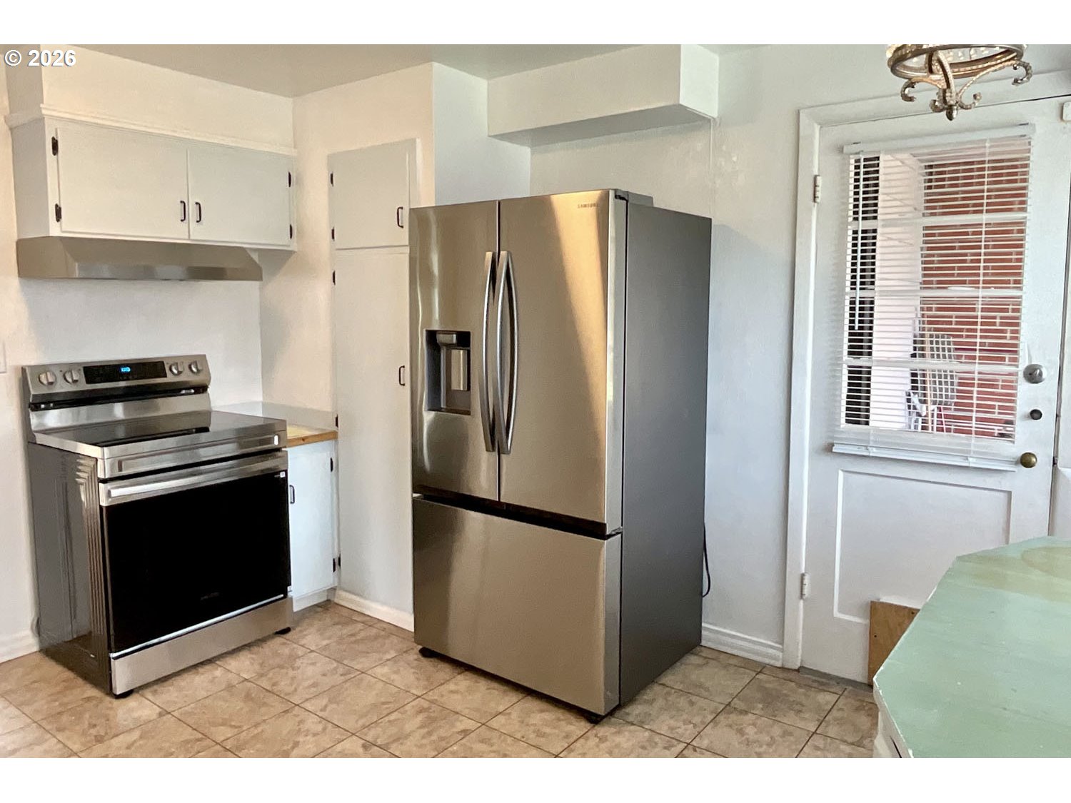 480 Gilbert Street Eugene, OR 97402 - Photo 11 of 33 a kitchen with stainless steel appliances granite countertop a refrigerator a stove a microwave and a refrigerator