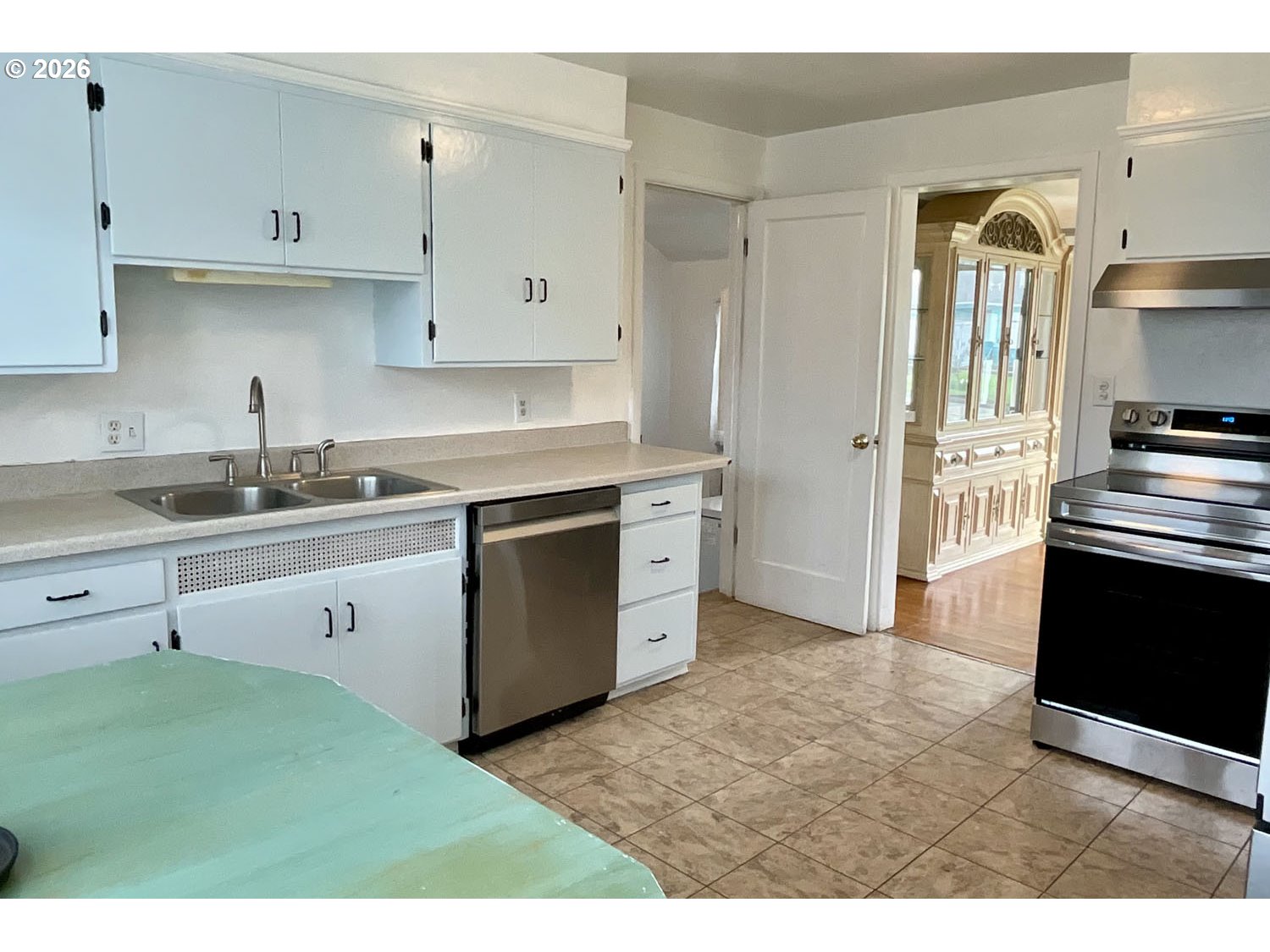 480 Gilbert Street Eugene, OR 97402 - Photo 12 of 33 a kitchen with cabinets stove and a sink