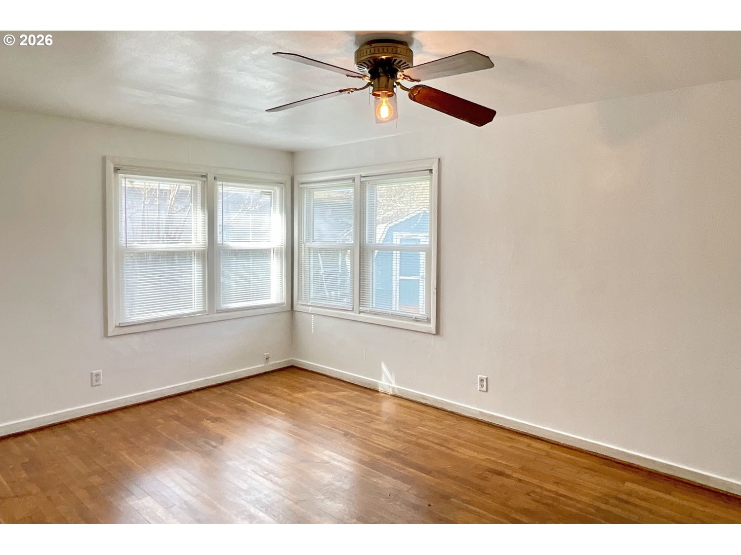 480 Gilbert Street Eugene, OR 97402 - Photo 14 of 33 a view of an empty room with window and wooden floor