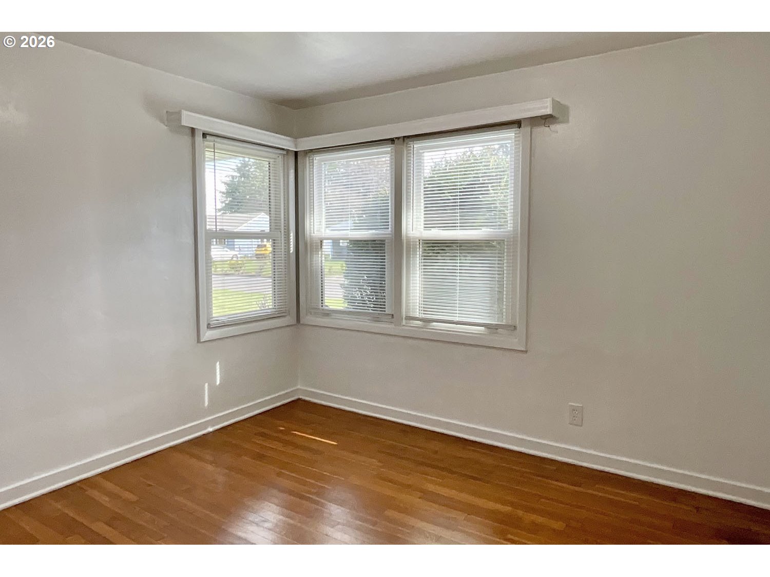 480 Gilbert Street Eugene, OR 97402 - Photo 17 of 33 an empty room with wooden floor and windows