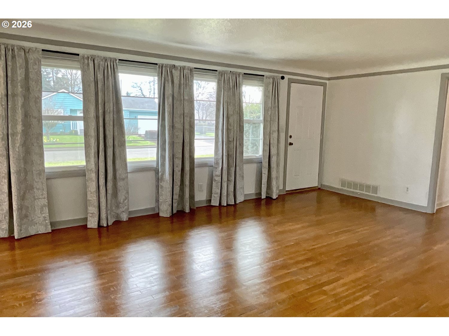 480 Gilbert Street Eugene, OR 97402 - Photo 2 of 33 a view of an empty room with wooden floor and a window