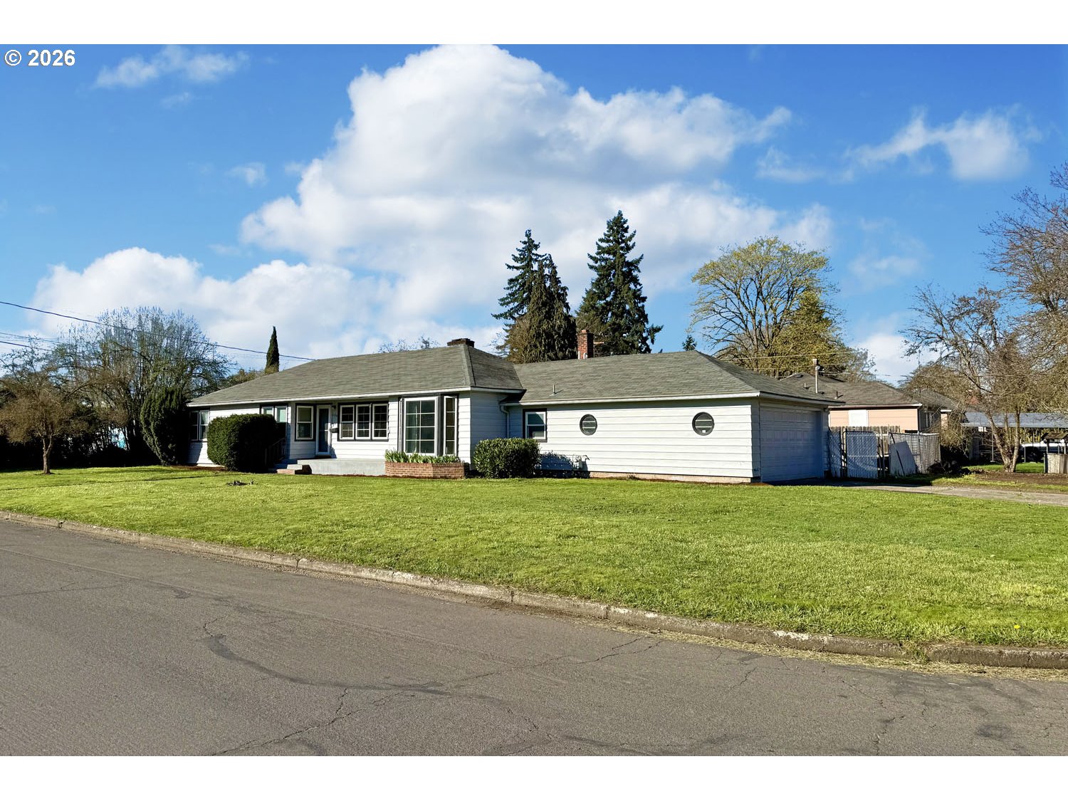 480 Gilbert Street Eugene, OR 97402 - Photo 29 of 33 a front view of a house with a yard and garage