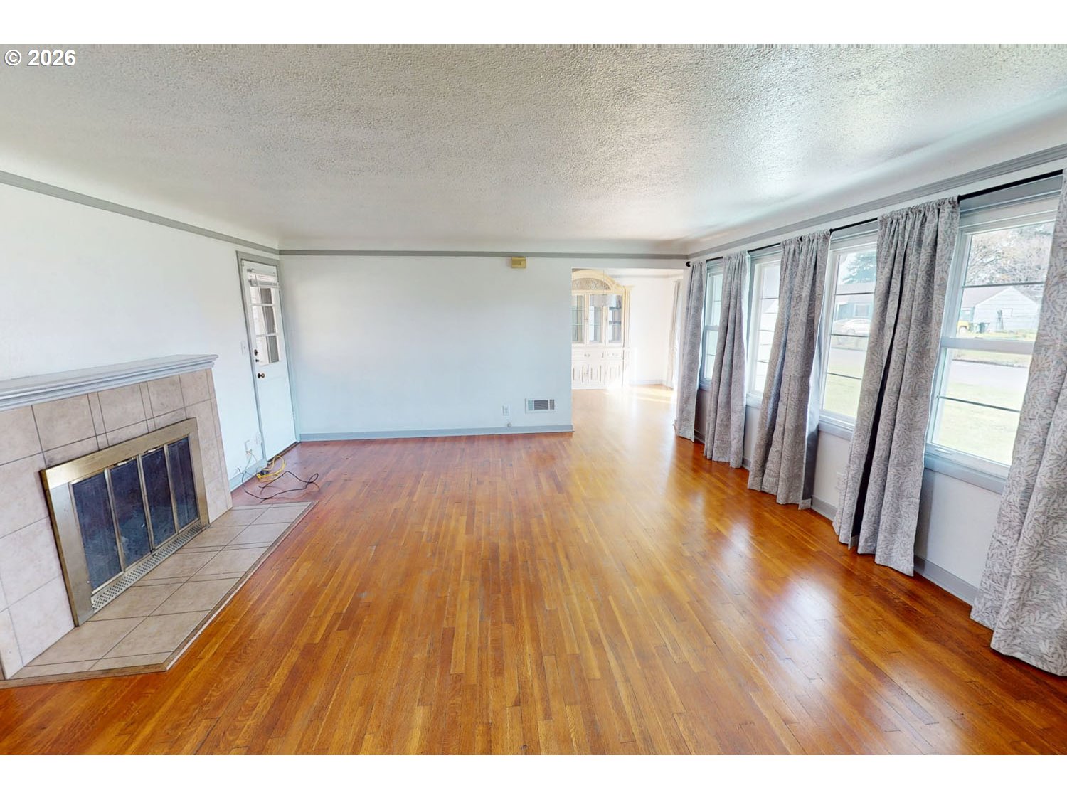 480 Gilbert Street Eugene, OR 97402 - Photo 4 of 33 a view interior of a house with wooden floor fireplace and windows