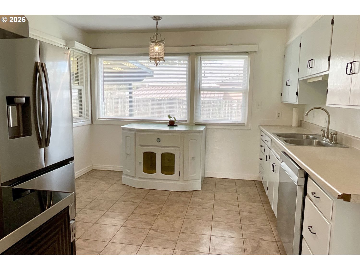 480 Gilbert Street Eugene, OR 97402 - Photo 9 of 33 a kitchen with stainless steel appliances granite countertop a sink stove and refrigerator