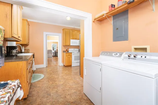 a view of hallway with washer and dryer