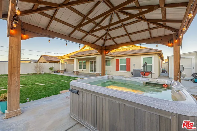 a front view of house with yard and outdoor seating