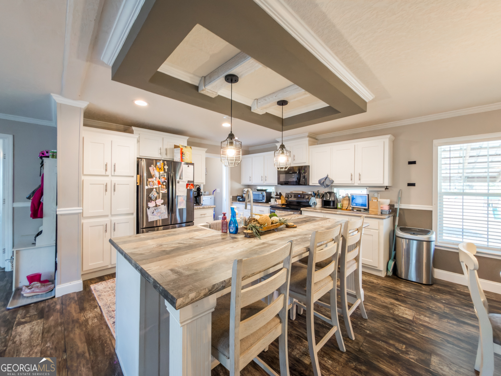 12546 Highway 1 Wrens, GA 30833 - Photo 11 of 41 a kitchen with stainless steel appliances kitchen island granite countertop a table chairs sink and cabinets