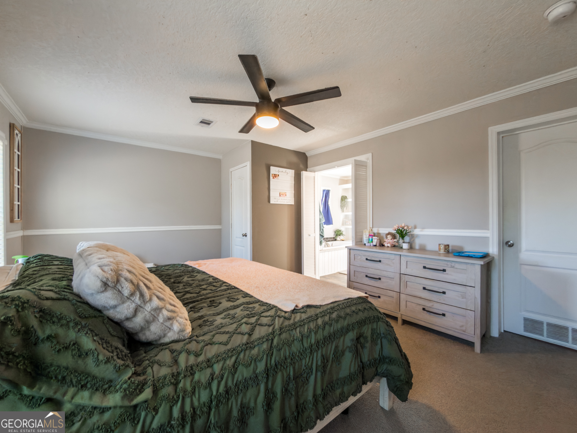 12546 Highway 1 Wrens, GA 30833 - Photo 22 of 41 a bedroom with a bed and a dresser