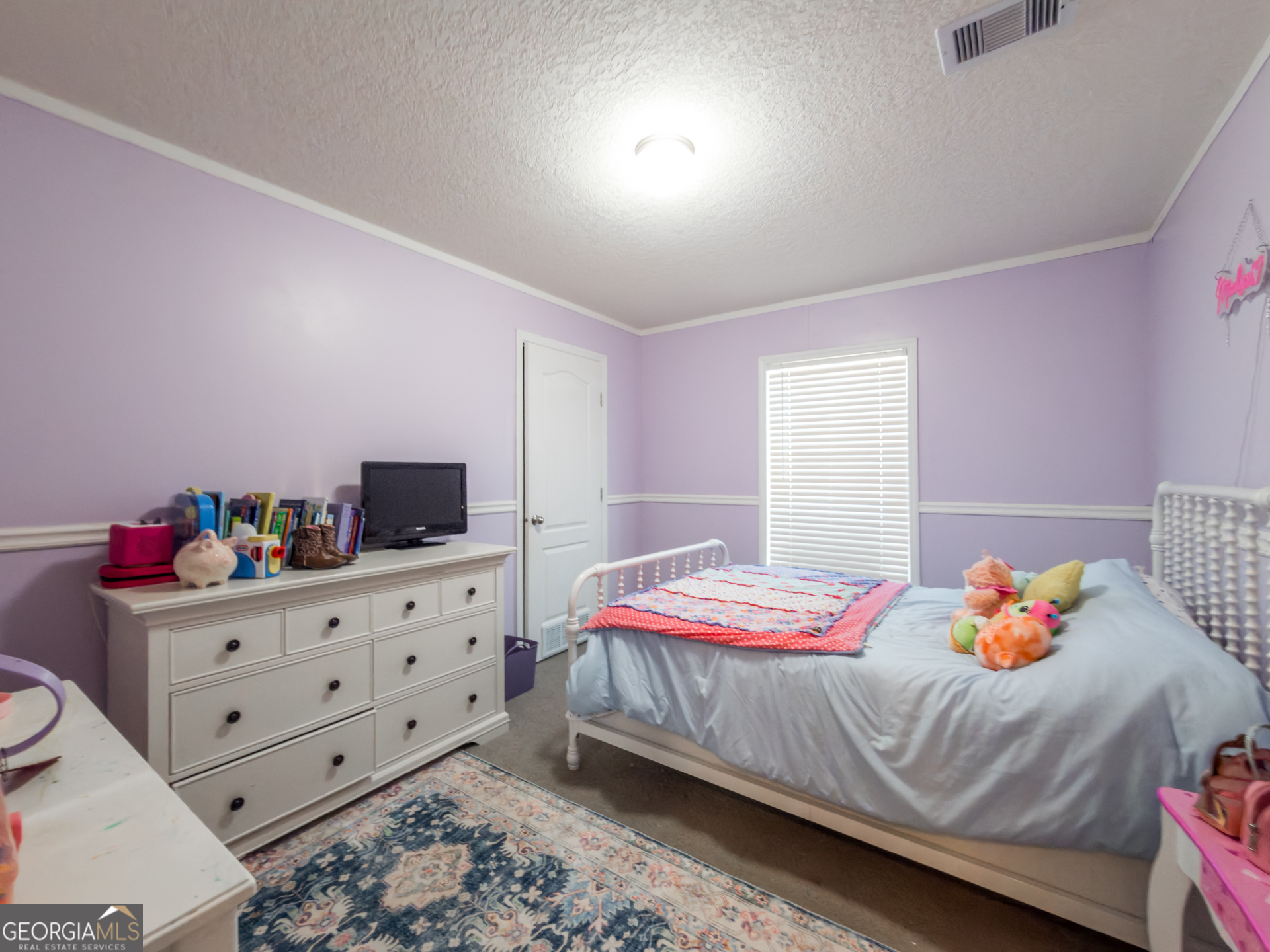 12546 Highway 1 Wrens, GA 30833 - Photo 28 of 41 a bedroom with a bed and a dresser in it