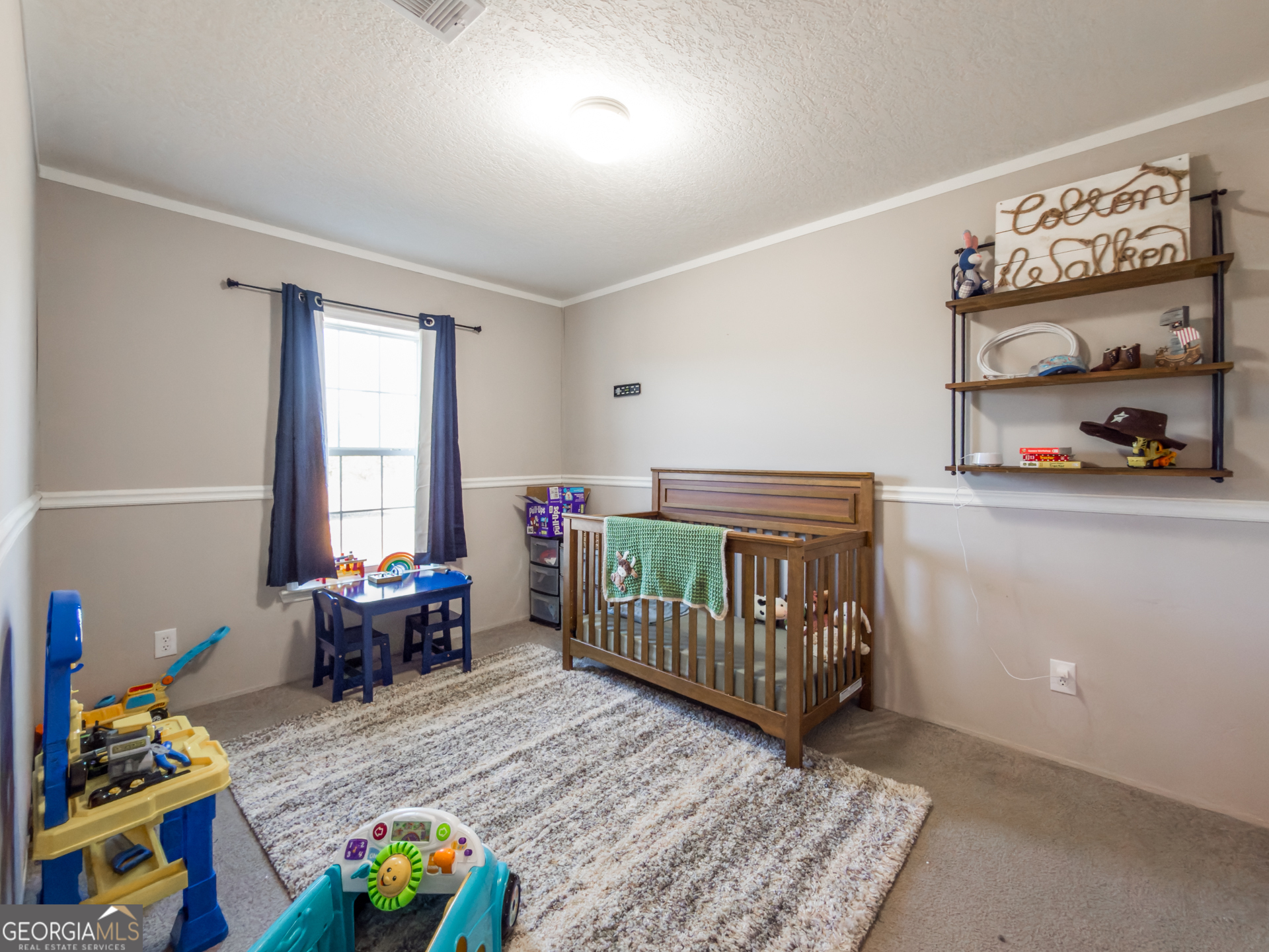 12546 Highway 1 Wrens, GA 30833 - Photo 30 of 41 a bedroom with furniture and a window