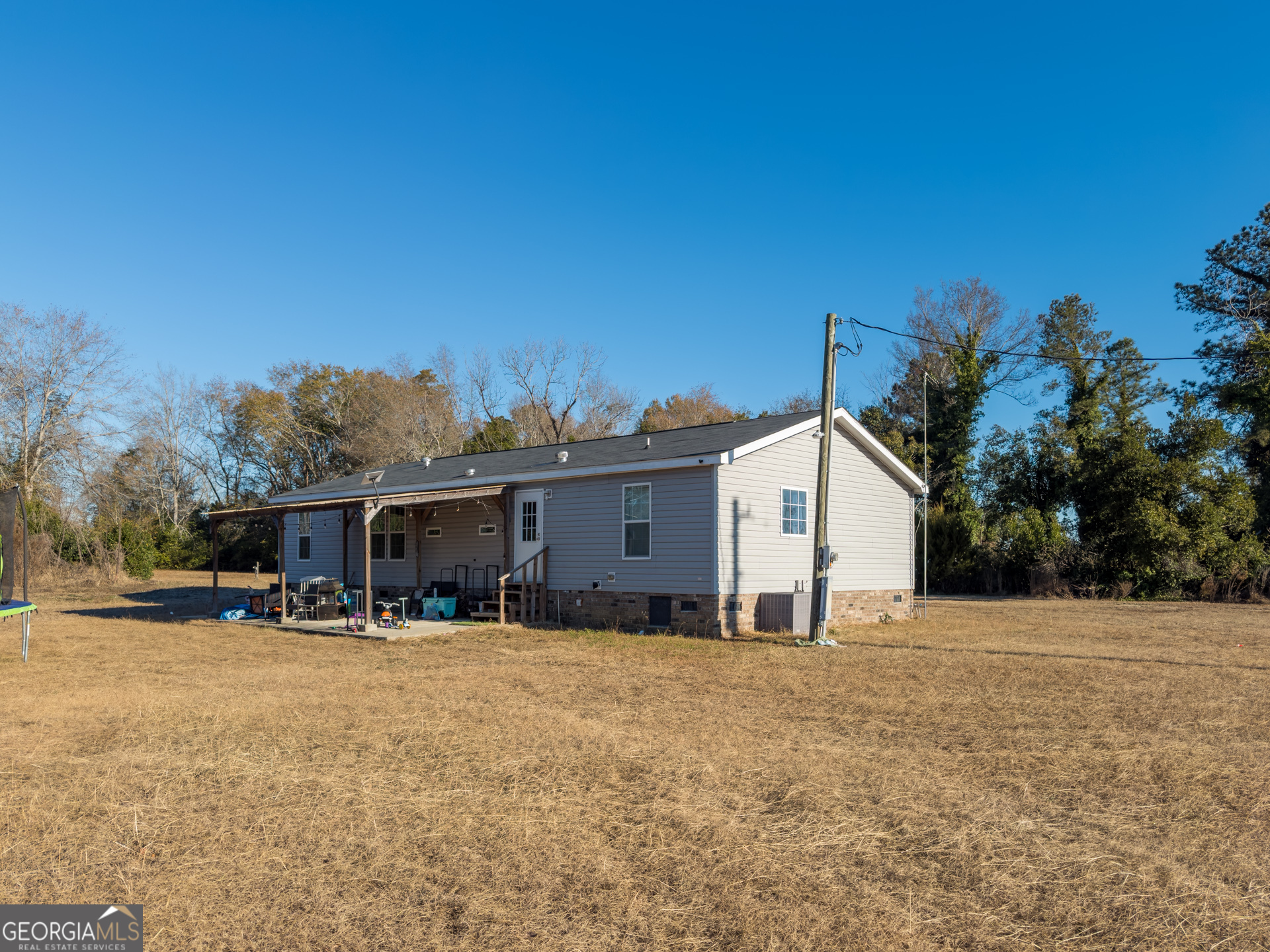 12546 Highway 1 Wrens, GA 30833 - Photo 35 of 41 a view of a house with a patio