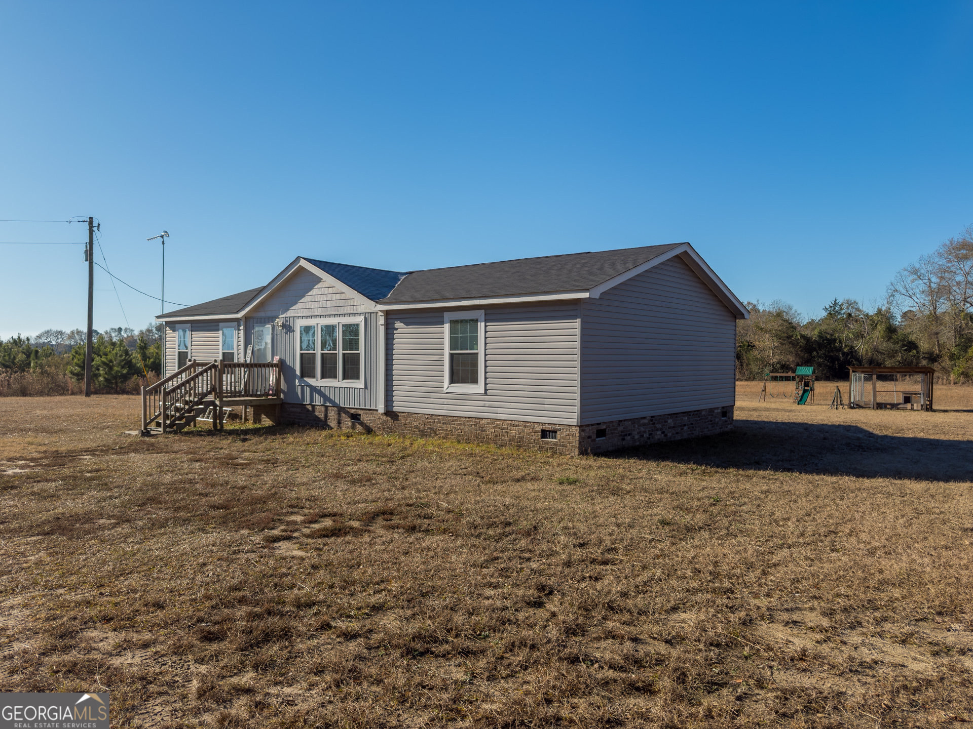 12546 Highway 1 Wrens, GA 30833 - Photo 4 of 41 a view of a house with a yard