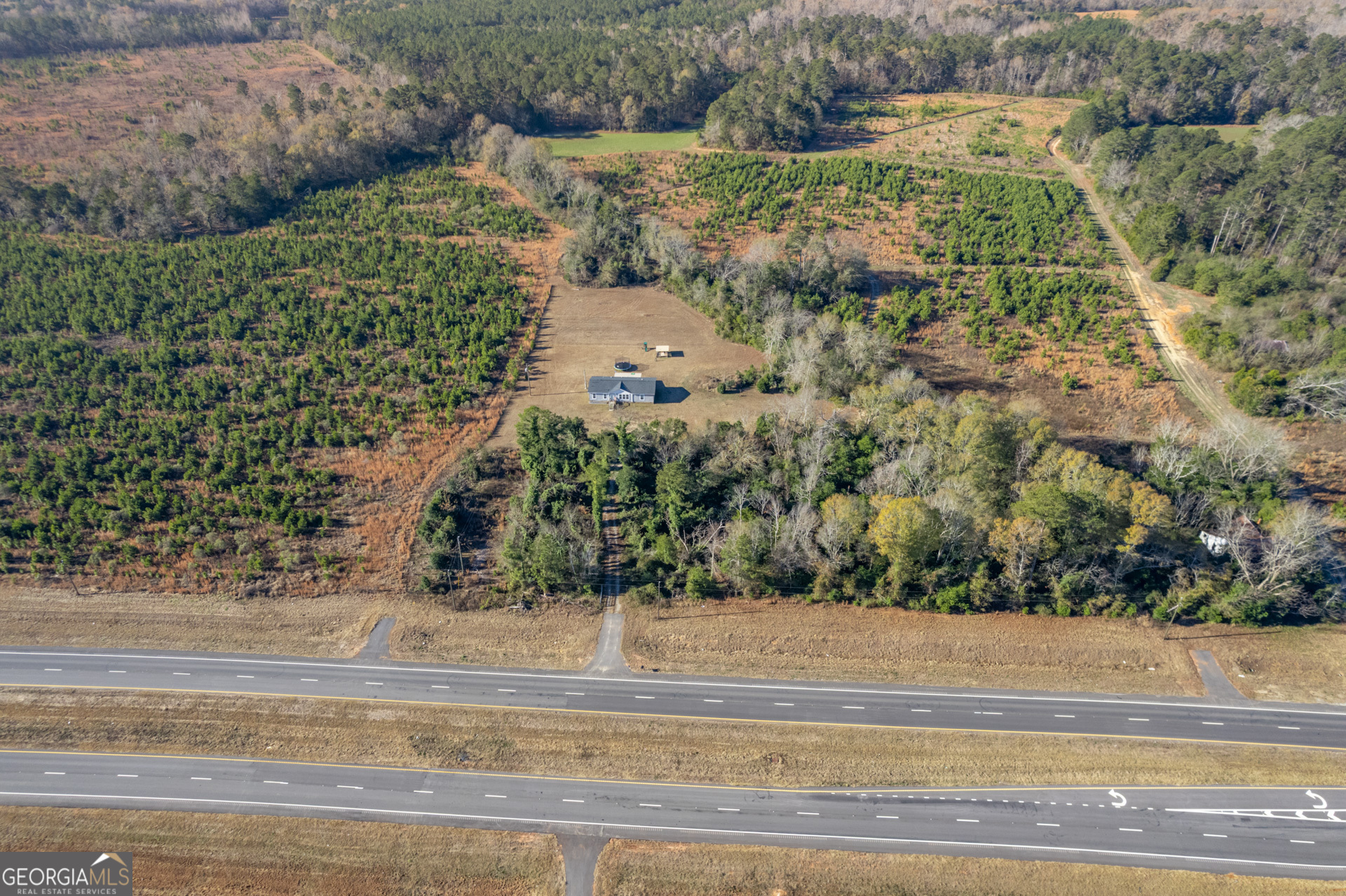12546 Highway 1 Wrens, GA 30833 - Photo 41 of 41 a view of a yard with large trees